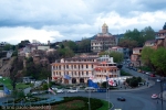 view of Europe Square with the Holy Trinity church on background from Meteki Church of Asumption in the evening in Tbilisi Georgia